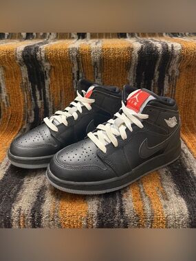 Jordan Kids Black Sneakers with White Laces and Red Tongue Logo